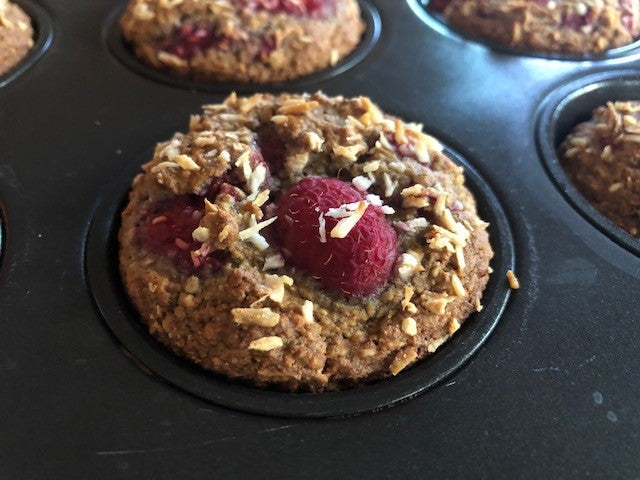Raspberry coconut muffins just out of the oven! Add raspberries to our classic base mix and sprinkle with shredded coconut.