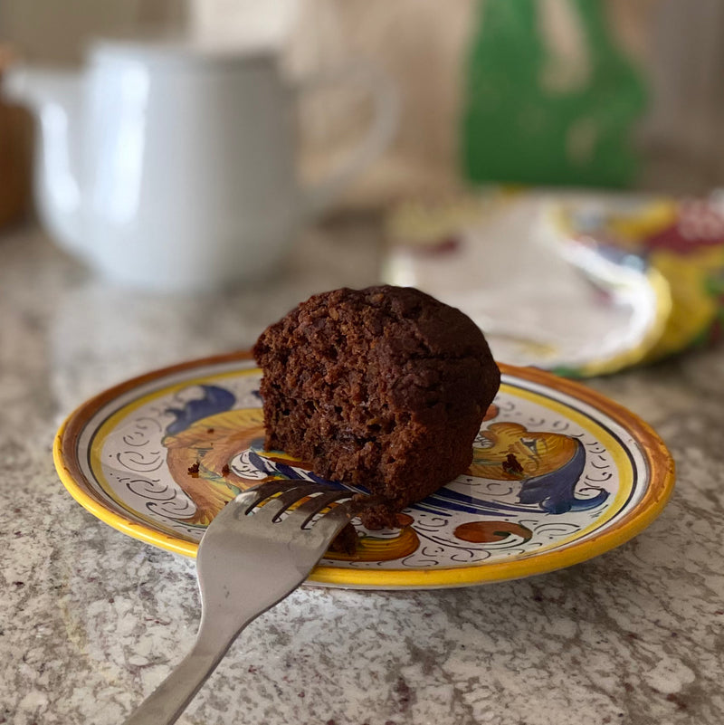 Moist and delicious zucchini double chocolate muffin on a beautiful plate.